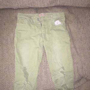 green ripped skinny jeans